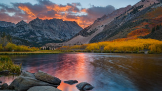 Mountain lake trees sunset clouds 8 - the foreground and a sunset in the background free wallpaper