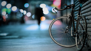 Bicycle wall night person tilt - a sidewalk free wallpaper