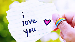 Person holding paper i love 2 - the end of it free wallpaper