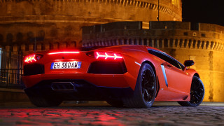 Red sports car night building 5 - andrew law free wallpaper
