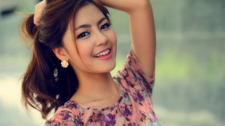 Woman flowered top smiling ponytail 3 - free portrait wallpaper