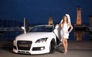 Woman white dress car hood - a tower in the background free wallpaper