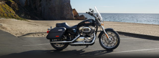 Motorcycle parked ocean cliff beach - a parking lot next free wallpaper