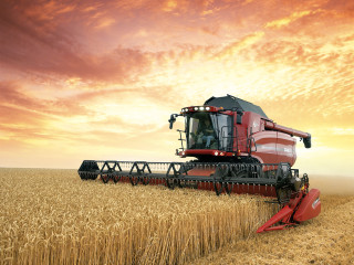 Red combine harvesting wheat cloudy 2 - cloudy free wallpaper