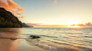 Beach wave sunset mountain distance 2 - a mountain in the distance free wallpaper