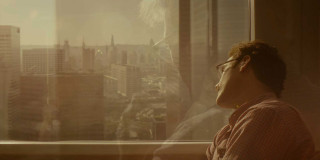 Man looking out window city - david boyd free wallpaper