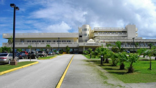Large building cars parked street - car free wallpaper