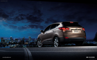 Car parked night city background - the side of a road free wallpaper