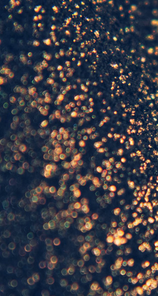 Bubbles black surface blurry background - a close up of a bunch free wallpaper