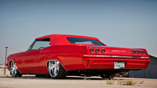Red car parked parking lot - clean free wallpaper