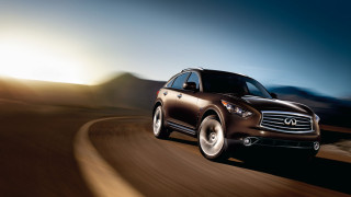 Brown car driving mountain range - andrew law free wallpaper