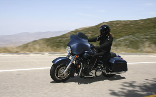 Motorcycle ride hillside mountain sky - a mountain in the background and a sky background free wallpaper