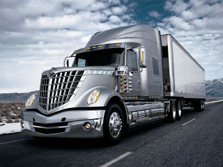 Semi truck driving road mountains - a semi truck free wallpaper