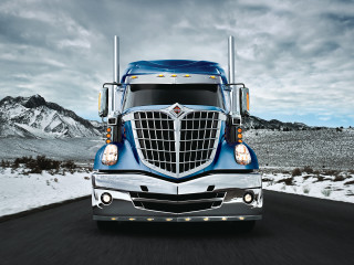 Blue semi truck driving road - evelyn abelson free wallpaper for desktop