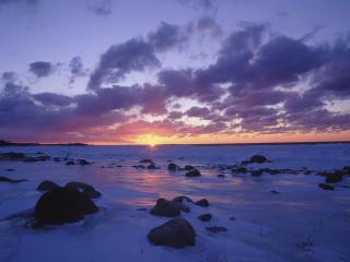 Sunset frozen lake rocks clouds - a sunset over a free wallpaper