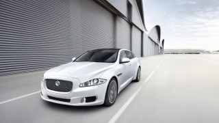 White car driving street building 3 - xf iq4 free wallpaper