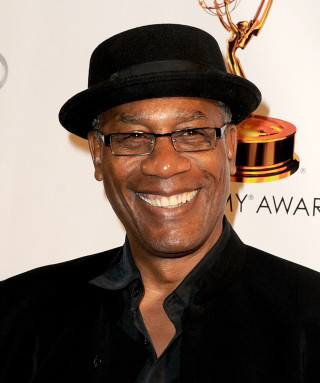 Man black hat glasses smiling - derold page free wallpaper