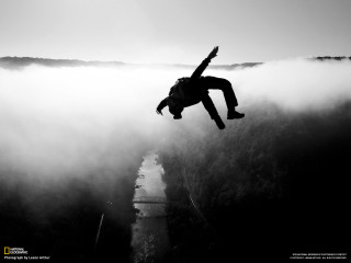 Man jumping off cliff arms - bernd fasching free wallpaper