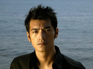 Man black shirt water beach - a man free wallpaper