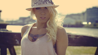 Woman hat water fence building - a building in the background free wallpaper