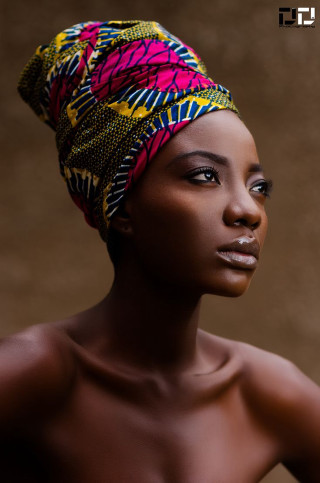 Woman head wrap brown background - a portrait free wallpaper