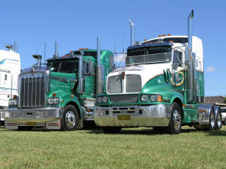 Green semi truck parked field - andries stock free wallpaper