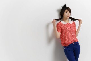 Woman ponytail red shirt blue - against a wall free wallpaper