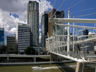 Boat river city buildings bridge - a river next free wallpaper