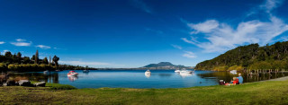 Lake boats mountain clouds people - a few person free wallpaper