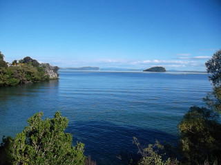 Water trees hill island nature - a small island in the distance free wallpaper