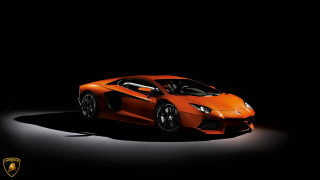 Orange sports car dark room - nice free wallpaper