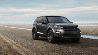 Grey range rover dirt road - a cloudy sky in the background free wallpaper