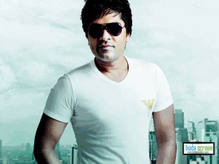 Man white shirt sunglasses cityscape - promotional image free wallpaper
