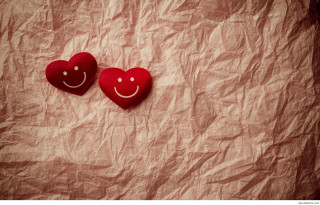 Red hearts with faces romanticism - a brown background free wallpaper