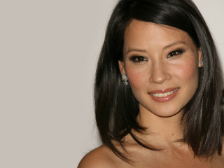 Smiling woman shoulderlength hair strapless - a large smile free wallpaper
