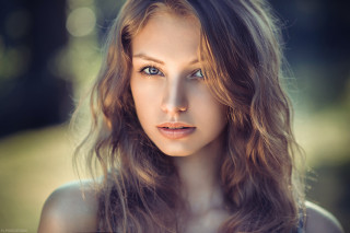 Eszter mattioni blonde hair blue - a blurry background of trees and grass free wallpaper