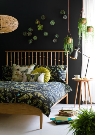 Bed green comforter plant wall - a lamp free wallpaper