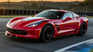 Red sports car race track 46 - a blurry background of trees and grass free wallpaper