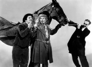 Three men holding horse woman - behind them free wallpaper