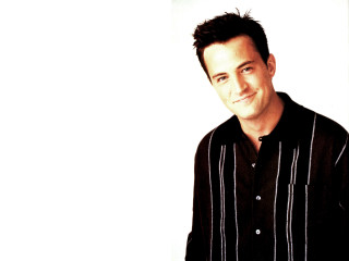 Man black shirt smiling white - a white wall behind free wallpaper