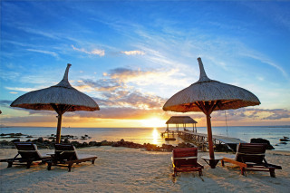 Beach chairs umbrellas sunset pier - a pier in the background free wallpaper