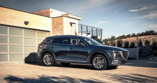 Black car garage door building - a black car free wallpaper