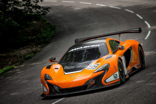 Orange sports car driving winding - road free wallpaper