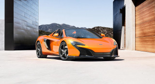 Orange sports car parked building 2 - open free wallpaper