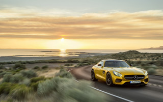 Yellow sports car ocean sunset 3 - a road near the ocean free wallpaper