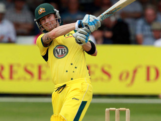 Man yellow uniform swinging bat - a ball free wallpaper