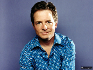 Man blue shirt blue background 2 - free portrait wallpaper
