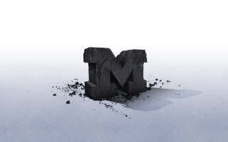 Black object letter m debris - a white surface free wallpaper