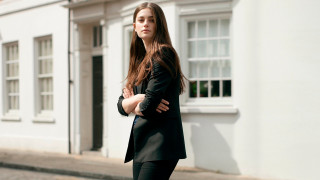 Woman standing street building clock - the side of a street next free wallpaper