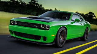 Green car driving road trees - a yellow line free wallpaper